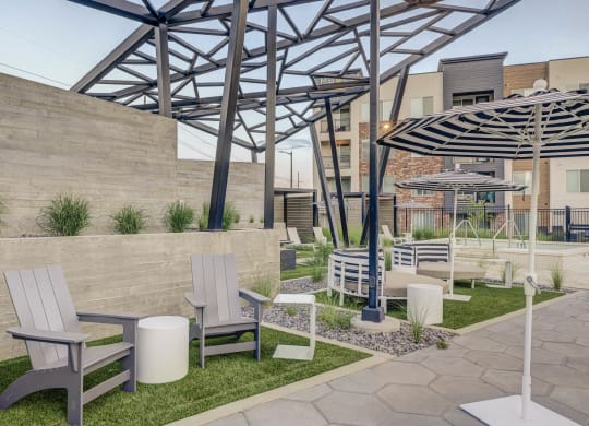 a rendering of a patio area with chairs and umbrellas