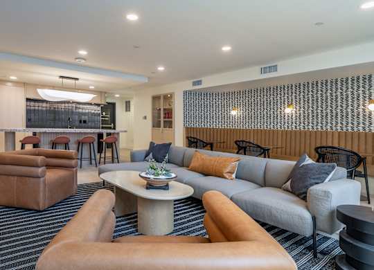 a living room with couches and chairs and a table