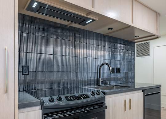 a kitchen with a sink and a stove in a house