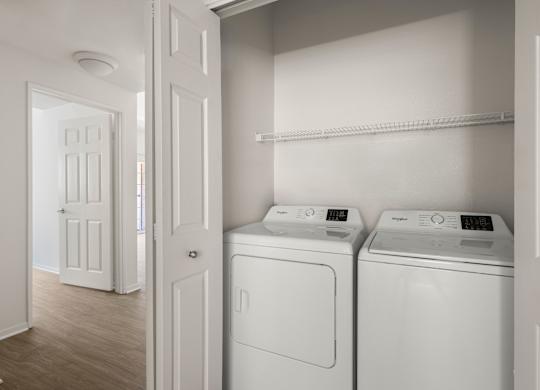 A laundry room with a washer and dryer.