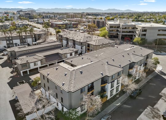 an aerial view of a group of apartment buildings in a city