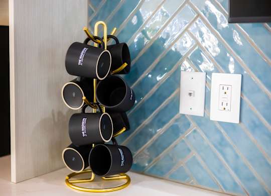 Stack of black mugs at The Madison at Adams Farm, Greensboro, NC