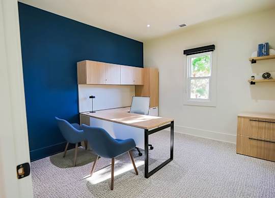 Room with wooden desk at The Madison at Adams Farm, Greensboro, 27407