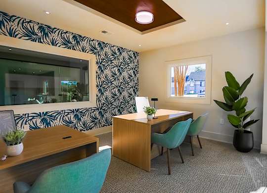 Room with desk and chairs at The Madison at Adams Farm, Greensboro, North Carolina