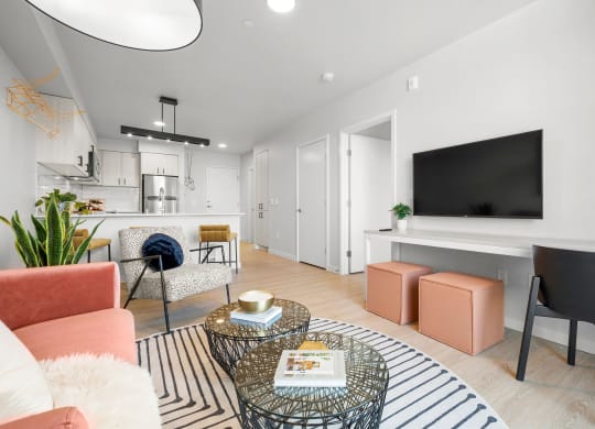 a living room with white walls and hardwood floors at Ion Town Center, Shoreline, WA 98133