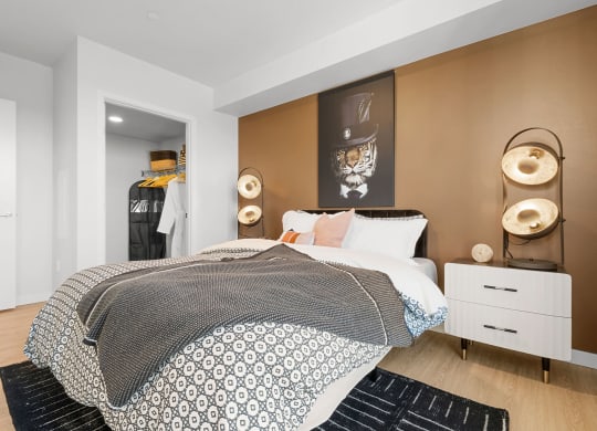 a bedroom with a bed and a dresser in front of it at Ion Town Center, Washington, 98133