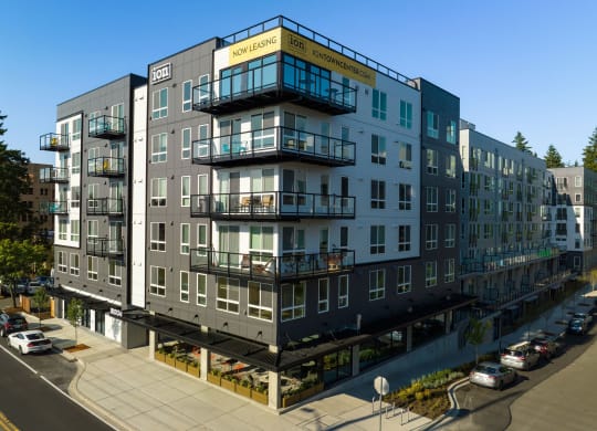 a rendering of a five story apartment building with balconies at Ion Town Center, Shoreline, WA 98133