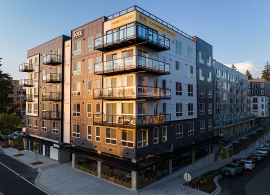 a rendering of a large apartment building with many balconies at Ion Town Center, Shoreline, WA