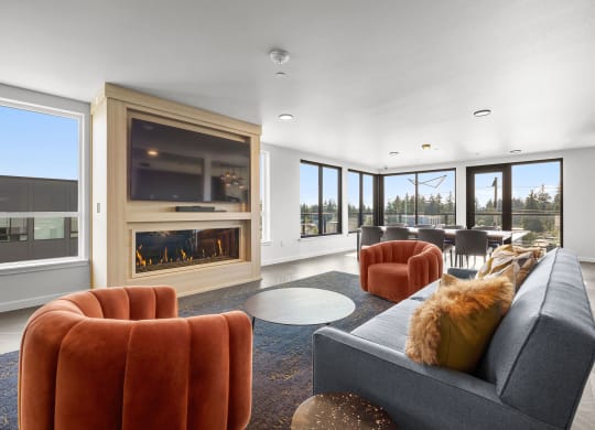 a living room with a fireplace and large windows at Ion Town Center, Shoreline, WA