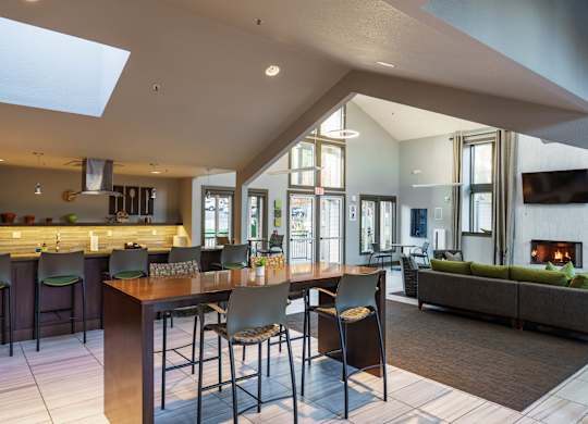 A modern kitchen with a bar area and a skylight.