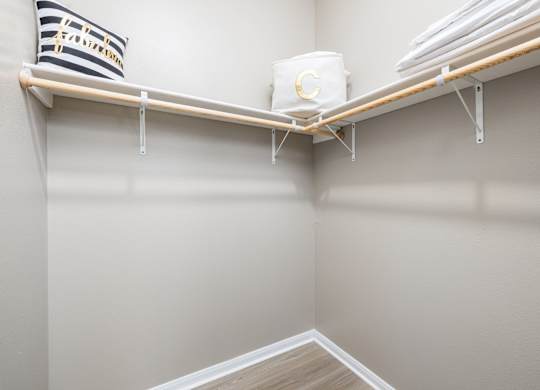 A white pillow with black stripes and the word at Clear Creek Meadows Apartments, Texas