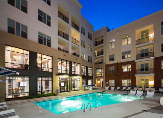 a swimming pool in the middle of an apartment building