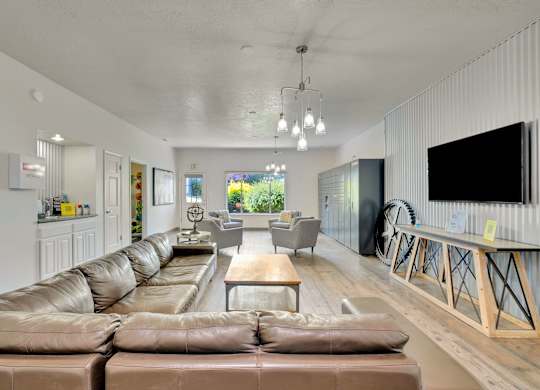A modern living room with a large sectional sofa and a flat-screen TV.