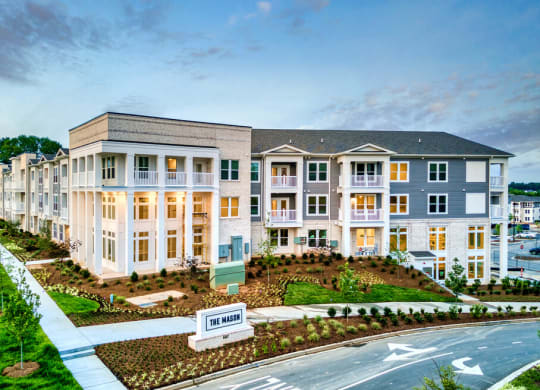 an aerial view of an apartment building at dusk