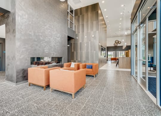 a large lobby with couches and a fireplace