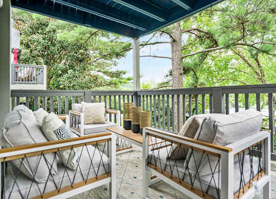 Outdoor balcony with seating and coffee table