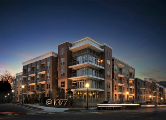 a rendering of an apartment building at night