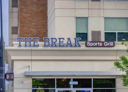 the break sports grill on the side of a building