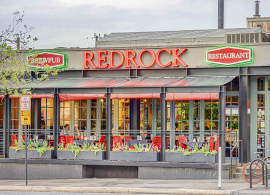 the facade of a restaurant with a red rock restaurant sign