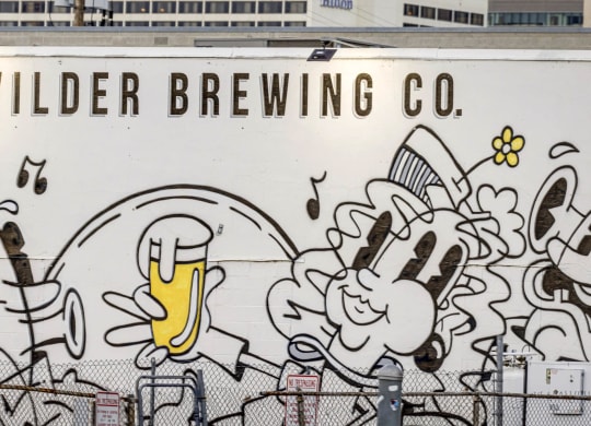 a mural on the side of a beer truck