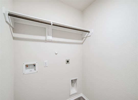 our apartments have a utility room with a sink and plenty of room to move around at The Village at Granger Pines, Conroe Texas