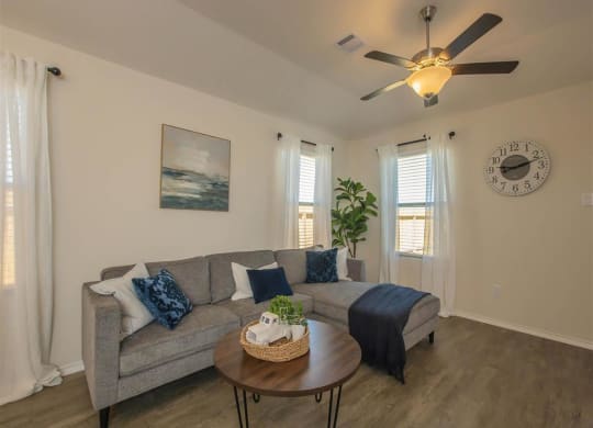 a living room with a couch and a coffee table at The Village at Granger Pines, Texas