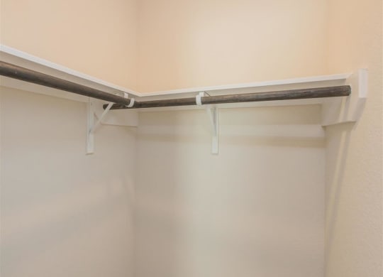 a walk in shower in a bathroom next to a wall at The Village at Granger Pines, Conroe, 77302
