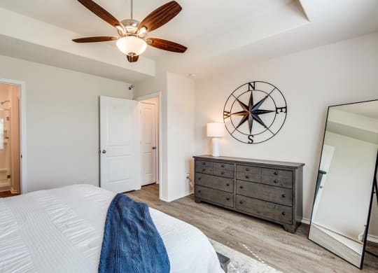 Bedroom With Ceiling Fan at The Village at Caney Mills, Conroe