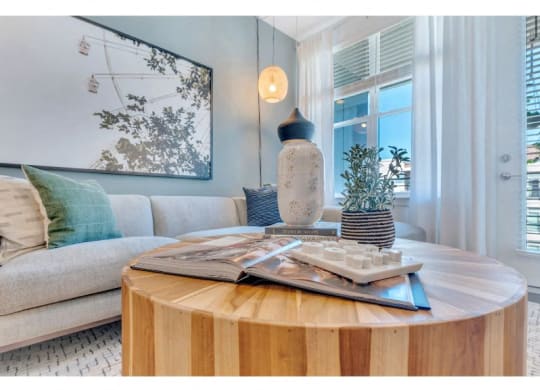 a living room with a table and a couch