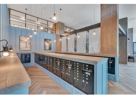a tasting room with blue walls and a long counter with wine racks