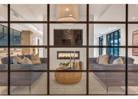 a living room with a couch and a fireplace