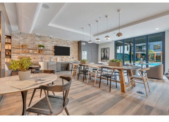 a restaurant with tables and chairs and a living room with a pool