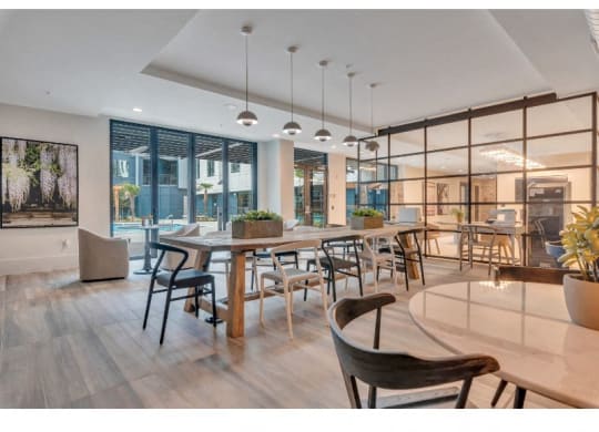 a large dining room with a large table and chairs