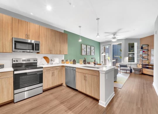 a large kitchen with wooden cabinets and stainless steel appliances