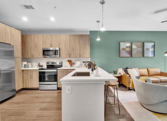 a living room with a kitchen and a dining room