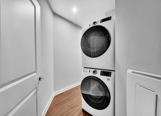 a front loading washer and dryer in a laundry room