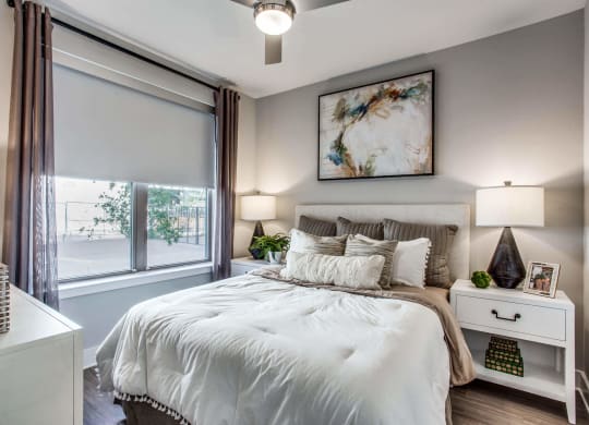 a bedroom with a large bed and a window