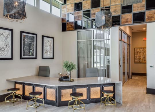 a dining room with a large table and chairs