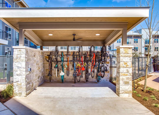 the front entrance of a building with a rack of skis on the wall