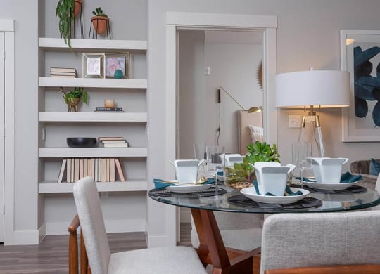 a dining room with a table and chairs