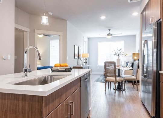 a kitchen and dining room with a sink