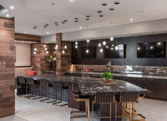 a large kitchen with a large island and chairs