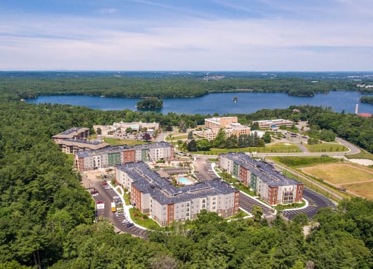 an aerial view of an apartment complex near a lake