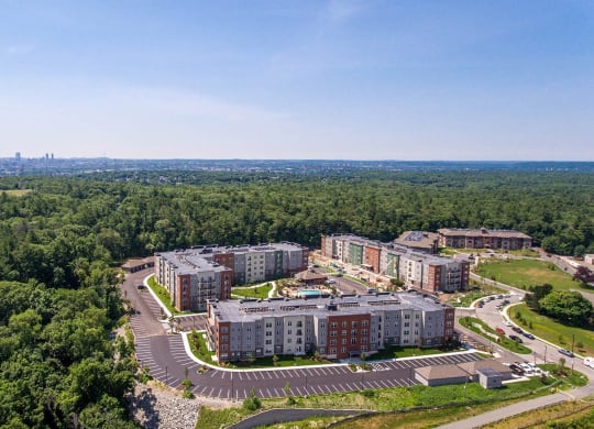 an aerial view of a campus with trees and buildings