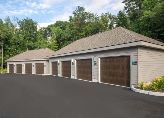 a large garage with a row of doors and a parking lot