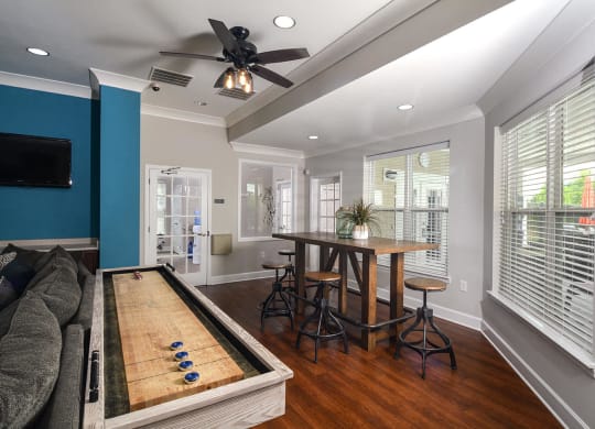 a game room with a pool table and a bar