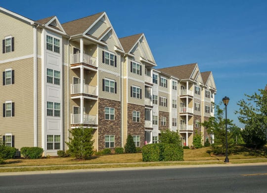 an apartment building on the side of a street
