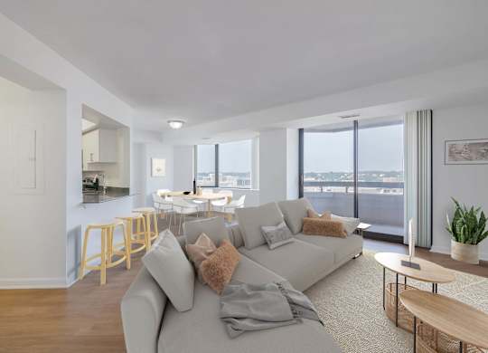 a living room with a couch and a table with chairs