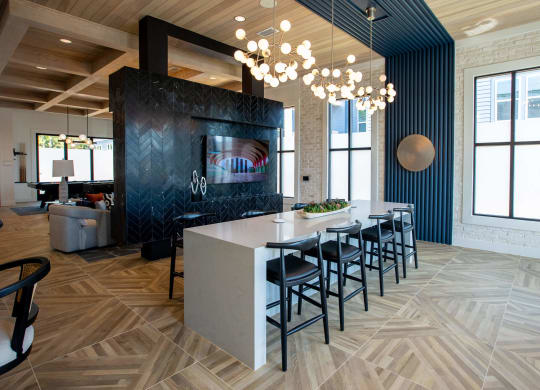 a dining room with a long table and chairs in a lobby
