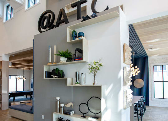 a wall with shelves and a sign on top of it